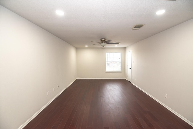 7707 Kempsey Ln, Houston, TX 77040 - empty room with a ceiling fan, baseboards, dark wood-style flooring, and recessed lighting