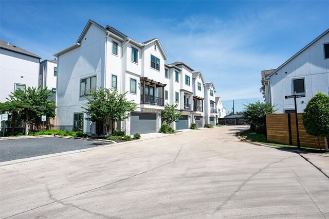 1747 Ojeman Spring Ln, Houston, TX 77055 - view of concrete road featuring a residential view and curbs