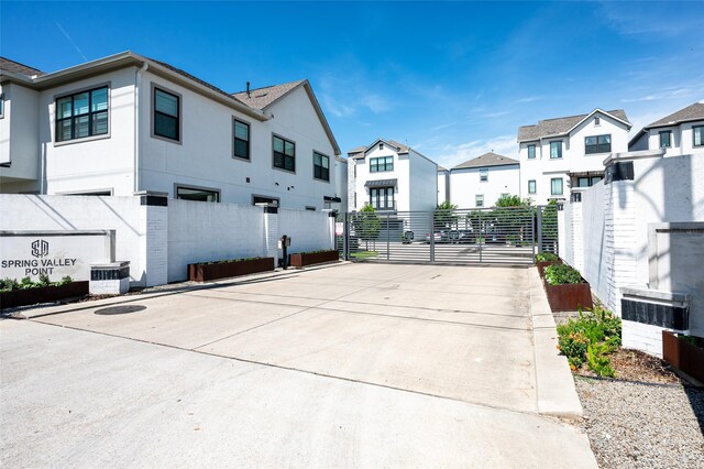 1747 Ojeman Spring Ln, Houston, TX 77055 - view of road featuring a gate and a residential view