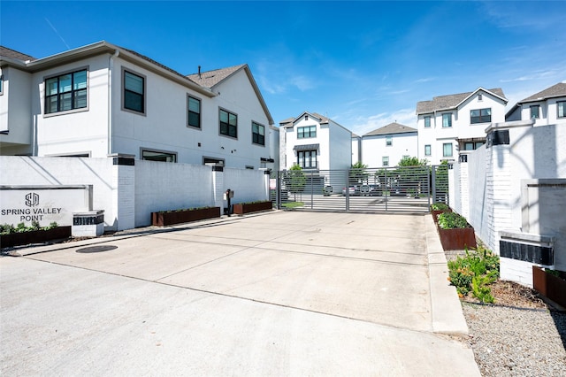 1747 Ojeman Spring Ln, Houston, TX 77055 - view of street featuring a gate and a residential view