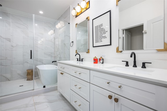 1747 Ojeman Spring Ln, Houston, TX 77055 - bathroom featuring marble finish floors, double vanity, a shower stall, a soaking tub, and recessed lighting