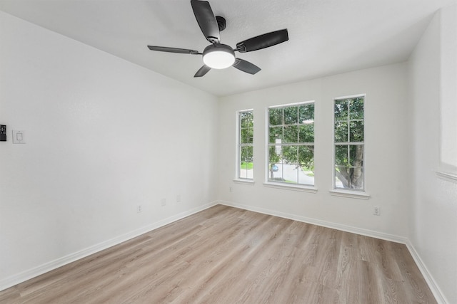 16739 Innisbrook Dr, Houston, TX 77095 - empty room featuring light wood-style floors, baseboards, and a ceiling fan