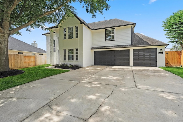 16739 Innisbrook Dr, Houston, TX 77095 - view of front of house with driveway, roof with shingles, a garage, and an attached garage