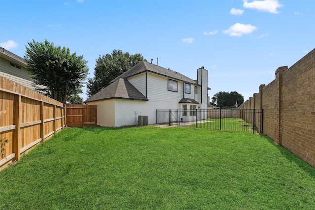 16739 Innisbrook Dr, Houston, TX 77095 - rear view of house featuring central air condition unit, a chimney, and roof with shingles