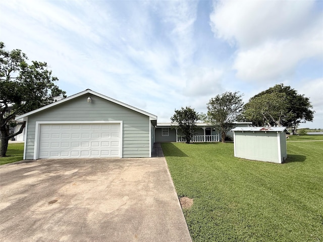 307 Veselka Road Cr, Freeport, TX 77541 - ranch-style house featuring a front lawn and a detached garage