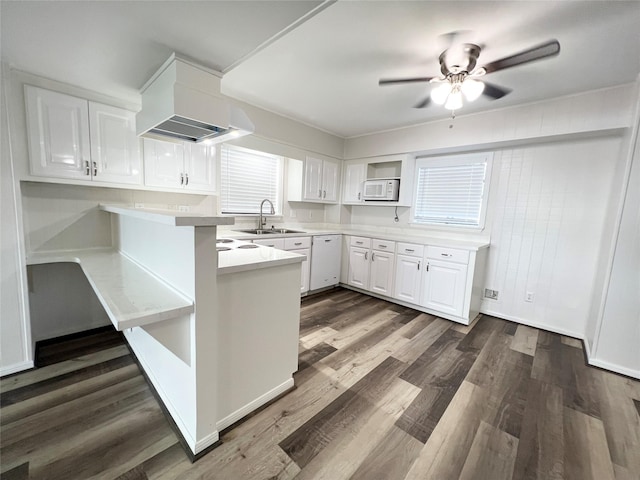 307 Veselka Road Cr, Freeport, TX 77541 - kitchen featuring white cabinetry, a ceiling fan, light countertops, a peninsula, and dark wood-type flooring