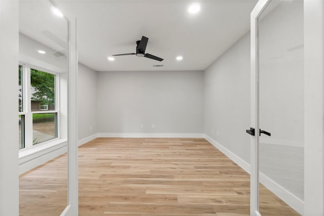 9 Indian Cedar Ln, The Woodlands, TX 77380 - unfurnished room featuring ceiling fan, recessed lighting, light wood finished floors, baseboards, and french doors