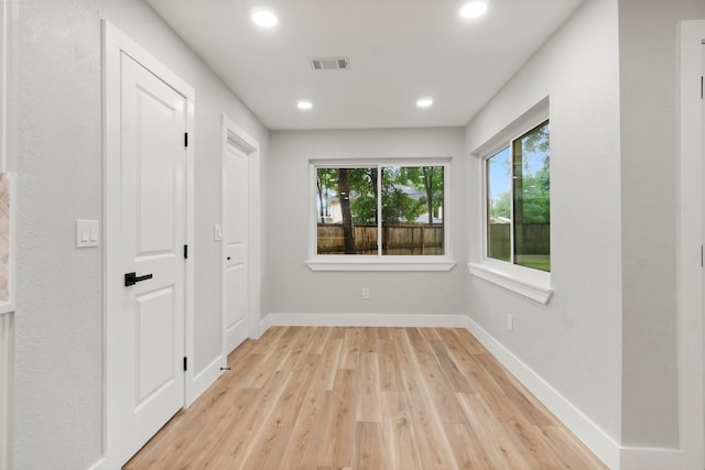9 Indian Cedar Ln, The Woodlands, TX 77380 - spare room featuring light wood-style floors, baseboards, and recessed lighting