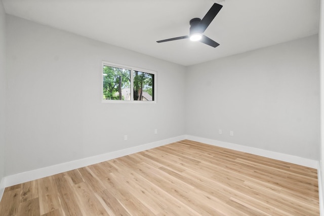 9 Indian Cedar Ln, The Woodlands, TX 77380 - unfurnished room with light wood-style floors, a ceiling fan, and baseboards