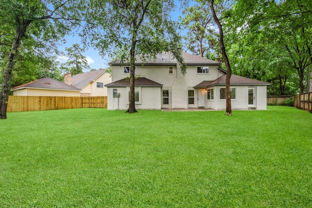 9 Indian Cedar Ln, The Woodlands, TX 77380 - rear view of property with a shingled roof