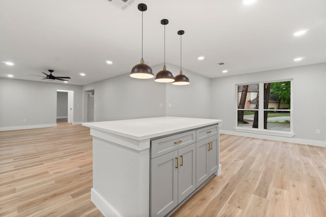 9 Indian Cedar Ln, The Woodlands, TX 77380 - kitchen featuring open floor plan, baseboards, gray cabinetry, a kitchen island, and recessed lighting
