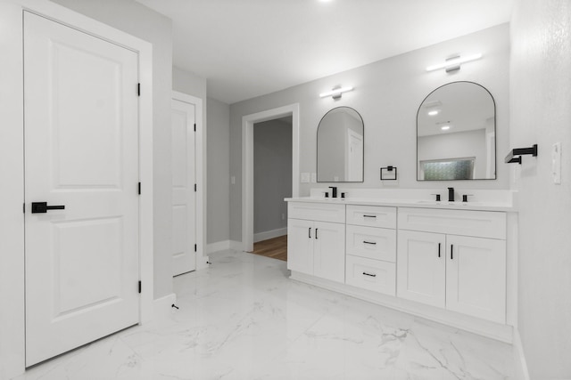 9 Indian Cedar Ln, The Woodlands, TX 77380 - full bath featuring baseboards, double vanity, and marble finish flooring