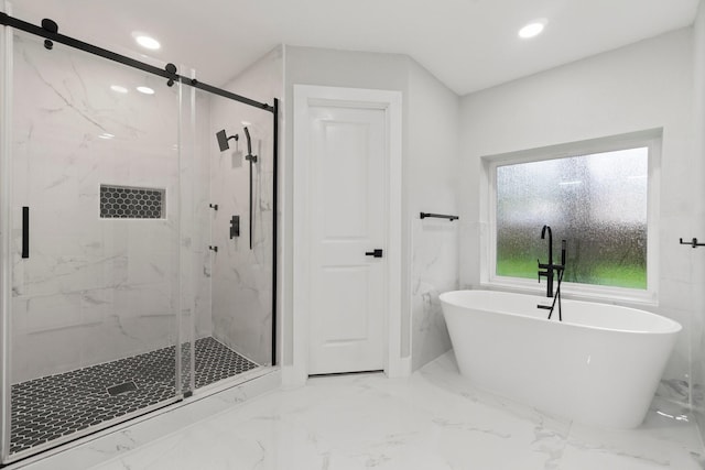 9 Indian Cedar Ln, The Woodlands, TX 77380 - bathroom with marble finish flooring, a freestanding bath, a marble finish shower, and recessed lighting