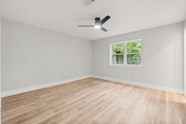 9 Indian Cedar Ln, The Woodlands, TX 77380 - empty room featuring baseboards, light wood-style floors, and a ceiling fan