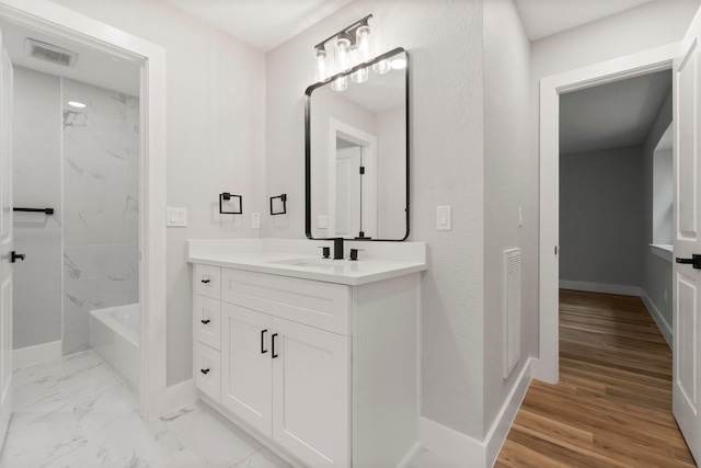 9 Indian Cedar Ln, The Woodlands, TX 77380 - full bath with vanity, baseboards, and tub / shower combination