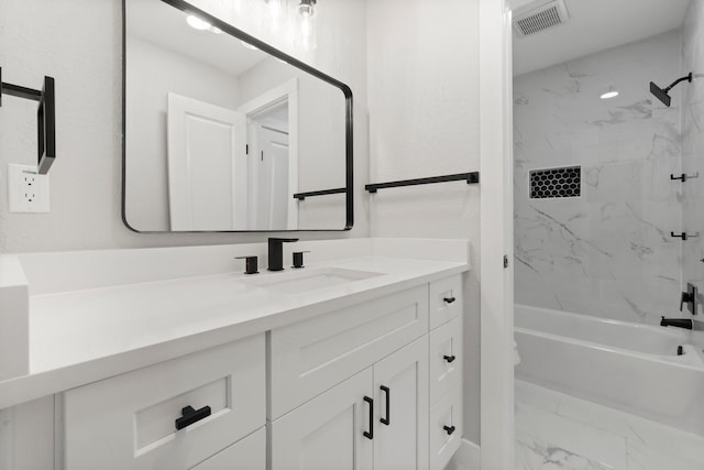 9 Indian Cedar Ln, The Woodlands, TX 77380 - bathroom featuring marble look tiles, vanity, and bathing tub / shower combination
