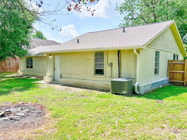 5813 Mayle St, Houston, TX 77016 - rear view of property with central AC unit and a shingled roof