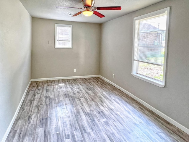 5813 Mayle St, Houston, TX 77016 - unfurnished room with wood finished floors, a ceiling fan, and baseboards
