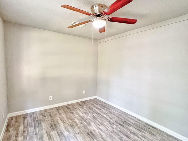 5813 Mayle St, Houston, TX 77016 - unfurnished room with wood finished floors, a ceiling fan, and baseboards