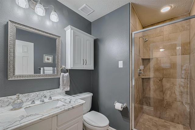 13719 Highland Cove Dr, Houston, TX 77070 - full bathroom featuring toilet, vanity, a stall shower, baseboards, and a textured ceiling