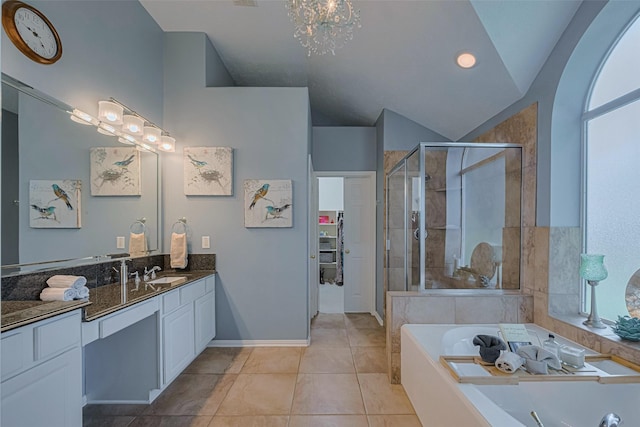 13719 Highland Cove Dr, Houston, TX 77070 - bathroom featuring vanity, a stall shower, a bath, lofted ceiling, and tile patterned flooring
