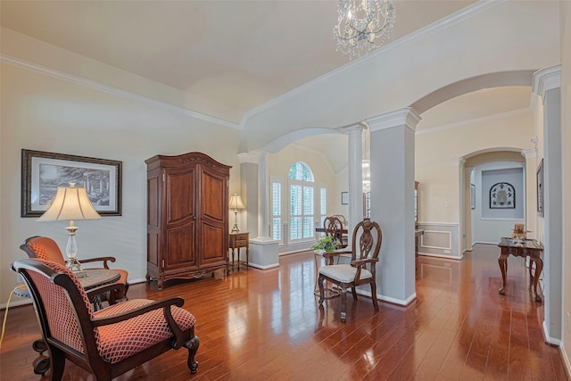 13719 Highland Cove Dr, Houston, TX 77070 - sitting room featuring ornate columns, arched walkways, ornamental molding, dark wood-style floors, and baseboards