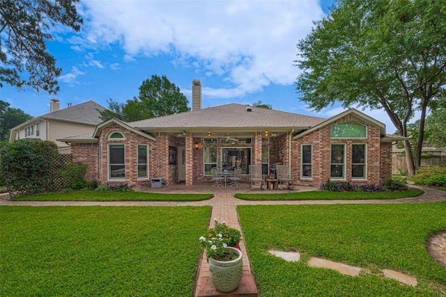 13719 Highland Cove Dr, Houston, TX 77070 - back of house featuring brick siding, a patio, and a chimney