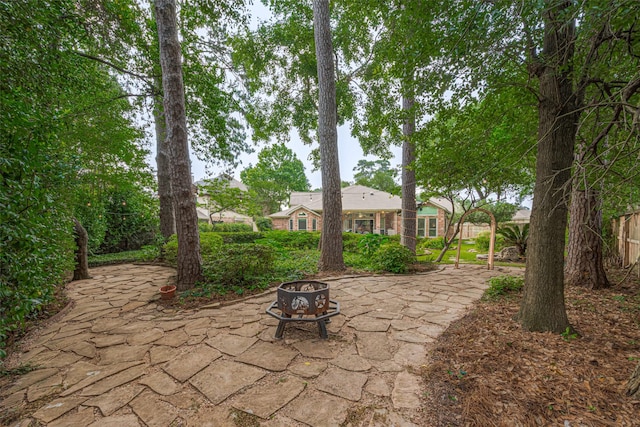 13719 Highland Cove Dr, Houston, TX 77070 - view of patio / terrace featuring a fire pit