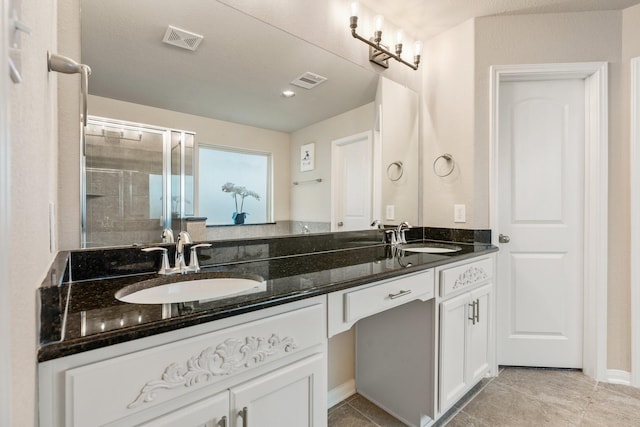 1724 Wandering Hills Rd, Conroe, TX 77304 - bathroom with double vanity, tile patterned flooring, and a shower with shower door