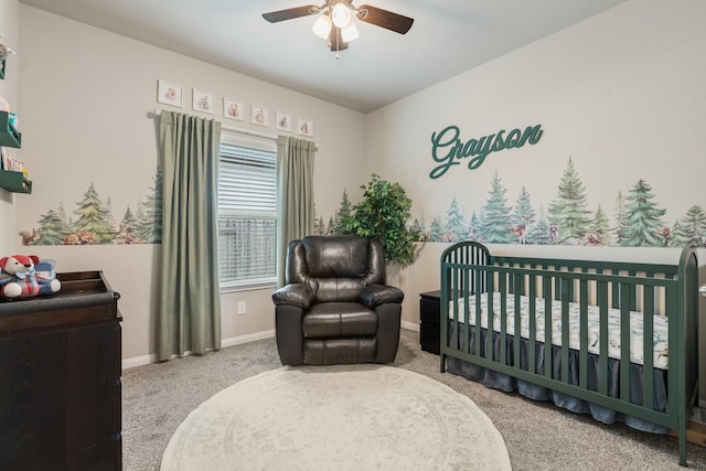 1724 Wandering Hills Rd, Conroe, TX 77304 - bedroom featuring carpet flooring, baseboards, a nursery area, and a ceiling fan