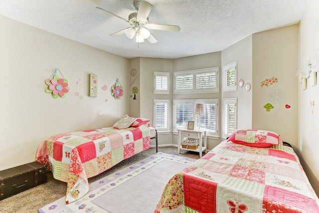 12203 Maple Rock Dr, Houston, TX 77077 - bedroom featuring carpet, ceiling fan, and a textured ceiling