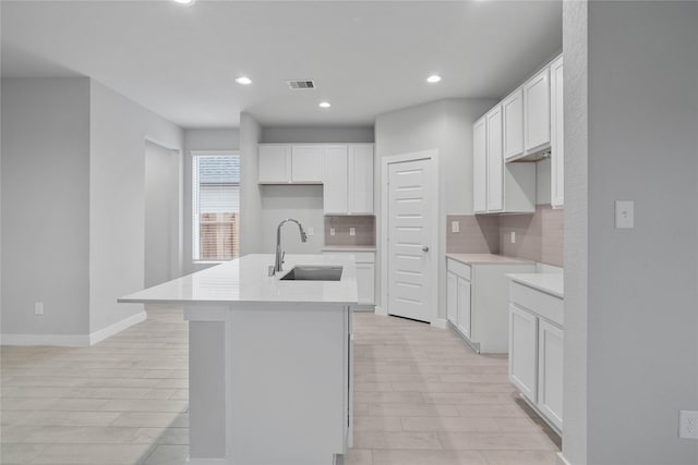 6630 Old Cypress Landing Ln, Humble, TX 77338 - kitchen featuring a sink, light wood-style floors, tasteful backsplash, and recessed lighting