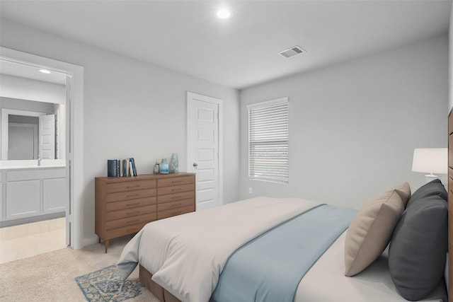 6630 Old Cypress Landing Ln, Humble, TX 77338 - bedroom featuring light colored carpet, recessed lighting, ensuite bathroom, and a sink