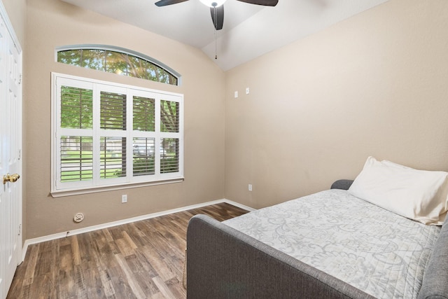 259 Adobe Ter S, Conroe, TX 77316 - bedroom with multiple windows, lofted ceiling, wood finished floors, and baseboards