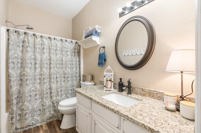 259 Adobe Ter S, Conroe, TX 77316 - bathroom featuring vanity, toilet, wood finished floors, and shower / bath combo