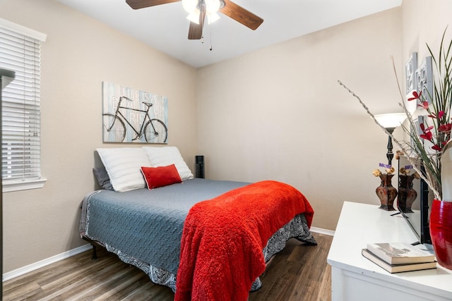 259 Adobe Ter S, Conroe, TX 77316 - bedroom with wood finished floors, baseboards, and ceiling fan