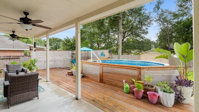 259 Adobe Ter S, Conroe, TX 77316 - wooden deck with a fenced backyard and ceiling fan