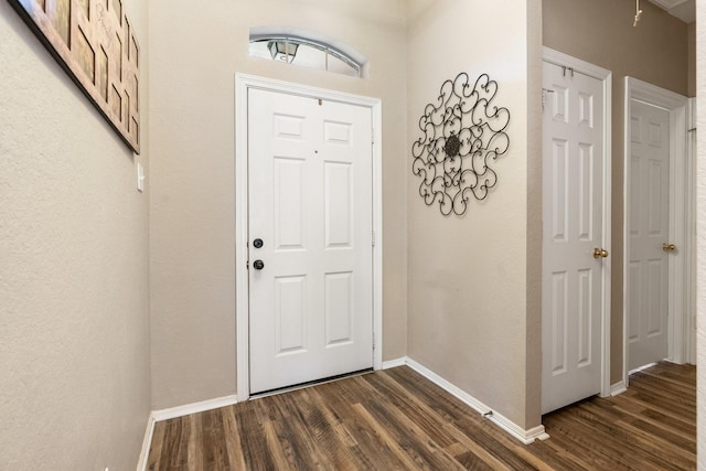 259 Adobe Ter S, Conroe, TX 77316 - entryway featuring dark wood finished floors and baseboards