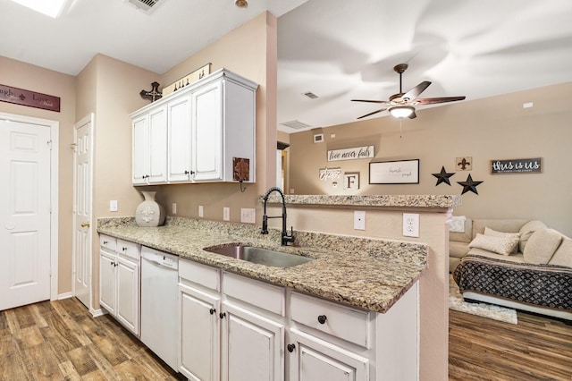 259 Adobe Ter S, Conroe, TX 77316 - kitchen with a sink, white dishwasher, wood finished floors, and a ceiling fan