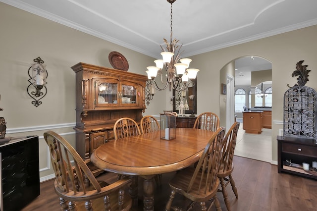 17419 Crescent Canyon Dr, Houston, TX 77095 - dining space with wine cooler, arched walkways, a chandelier, ornamental molding, and dark wood finished floors