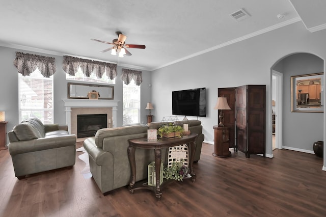 17419 Crescent Canyon Dr, Houston, TX 77095 - living room featuring a ceiling fan, wood finished floors, arched walkways, ornamental molding, and baseboards