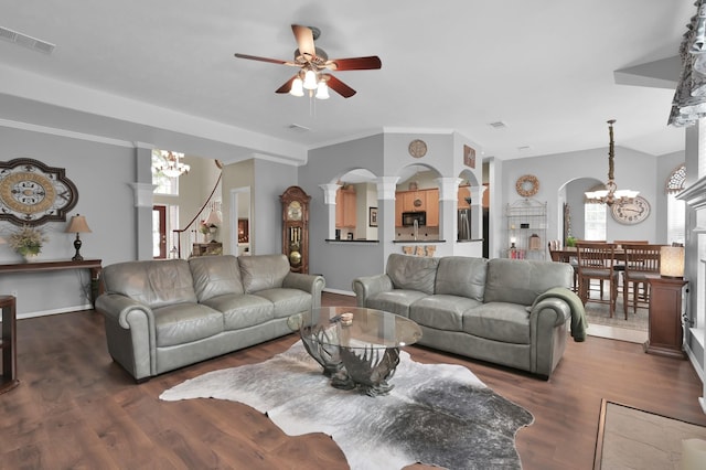 17419 Crescent Canyon Dr, Houston, TX 77095 - living area with a chandelier, arched walkways, a ceiling fan, dark wood-style flooring, and ornate columns