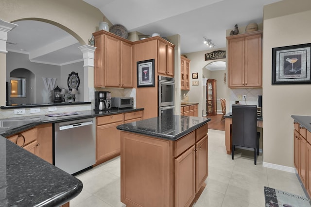 17419 Crescent Canyon Dr, Houston, TX 77095 - kitchen with stainless steel appliances, arched walkways, backsplash, and light tile patterned flooring