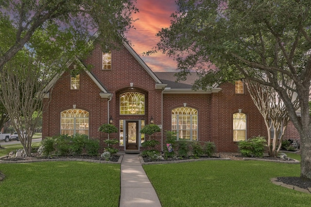 17419 Crescent Canyon Dr, Houston, TX 77095 - view of front facade with brick siding, a yard, and a shingled roof