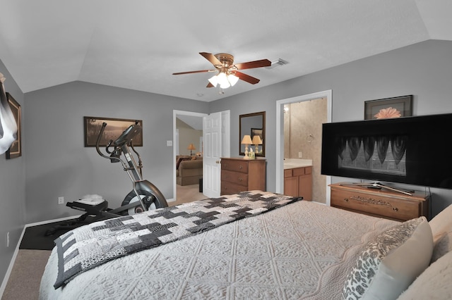 17419 Crescent Canyon Dr, Houston, TX 77095 - carpeted bedroom with vaulted ceiling, baseboards, a ceiling fan, and ensuite bath
