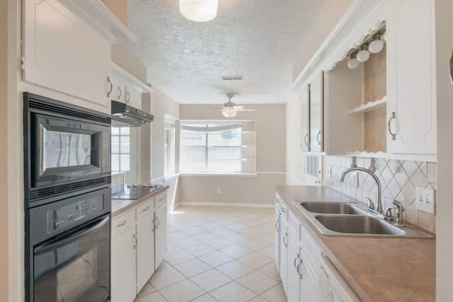 12503 Tall Forest Dr, Cypress, TX 77429 - kitchen with black appliances, under cabinet range hood, a sink, light tile patterned flooring, and open shelves