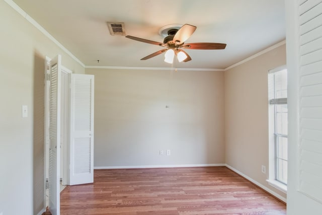12503 Tall Forest Dr, Cypress, TX 77429 - spare room with ceiling fan, wood finished floors, ornamental molding, and baseboards
