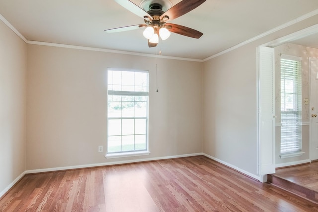 12503 Tall Forest Dr, Cypress, TX 77429 - spare room with light wood-style flooring, plenty of natural light, baseboards, and ornamental molding