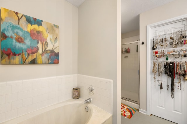 5227 Aberton Ln, Spring, TX 77379 - bathroom with a garden tub and a stall shower