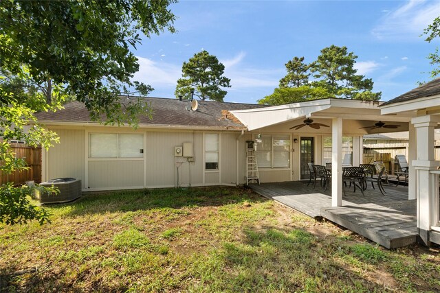 5227 Aberton Ln, Spring, TX 77379 - back of house with a ceiling fan, outdoor dining space, a deck, cooling unit, and a shingled roof